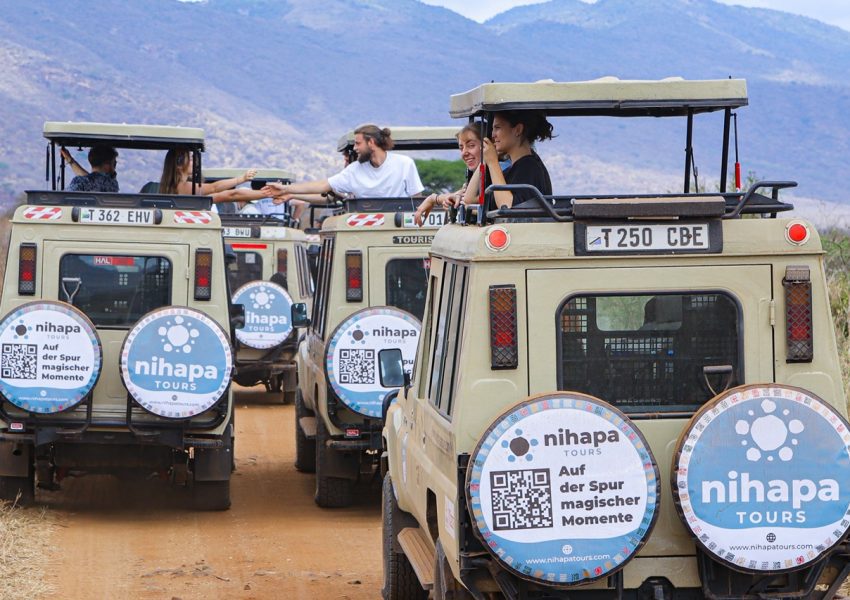 Visitors enjoying a wildlife safari inside a Nihapa Tours vehicle in Tanzania, showing what an African safari costs