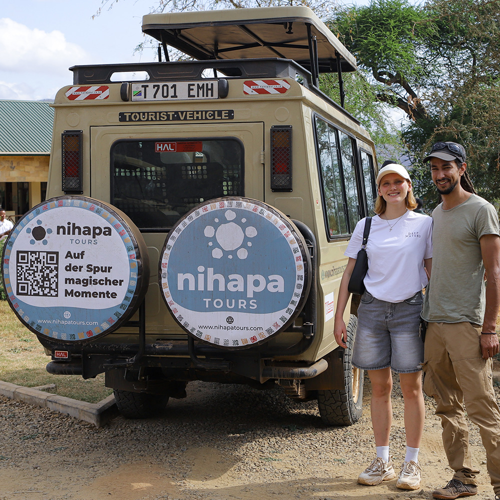 Visitors enjoying a guided game drive in a Nihapa Tours vehicle during an 11-Day Tanzania and Zanzibar Safari.