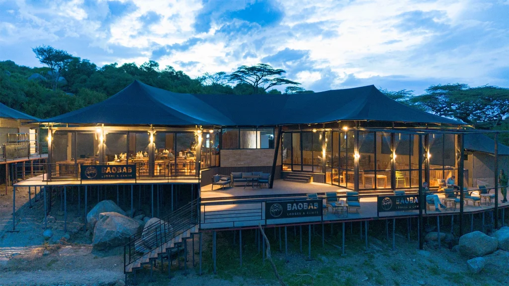 aobab Naabi Luxury Camp tents with acacia trees in the southern Serengeti